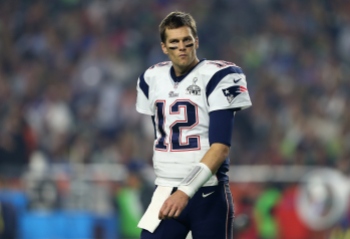 Tom Brady warms up prior to Super Bowl XLIX.