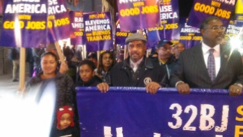 Rev. Michael Blackwell, center, stands with East Orange Mayor Lester Taylor, right, at a protest in Newark for higher wages for airport employees.  (Photo courtesy of Rev. Blackwell)